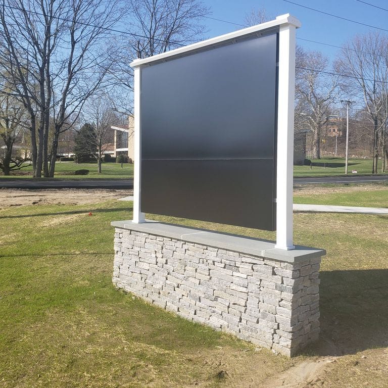 Application image for Granite - Liberty Hill. The image shows this material being used in a landscape wallstone application.