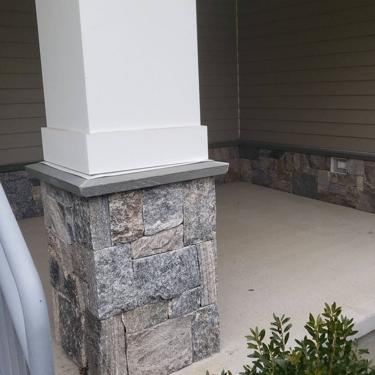 Application image for Liberty Hill Granite. The image shows this material being used in a columns application. This is a building and landscape stone for indoor and outdoor commercial and residential applications. Suitable for general use, freeze-thaw conditions and low slipperiness surfaces situations. Relatively moderate in price.