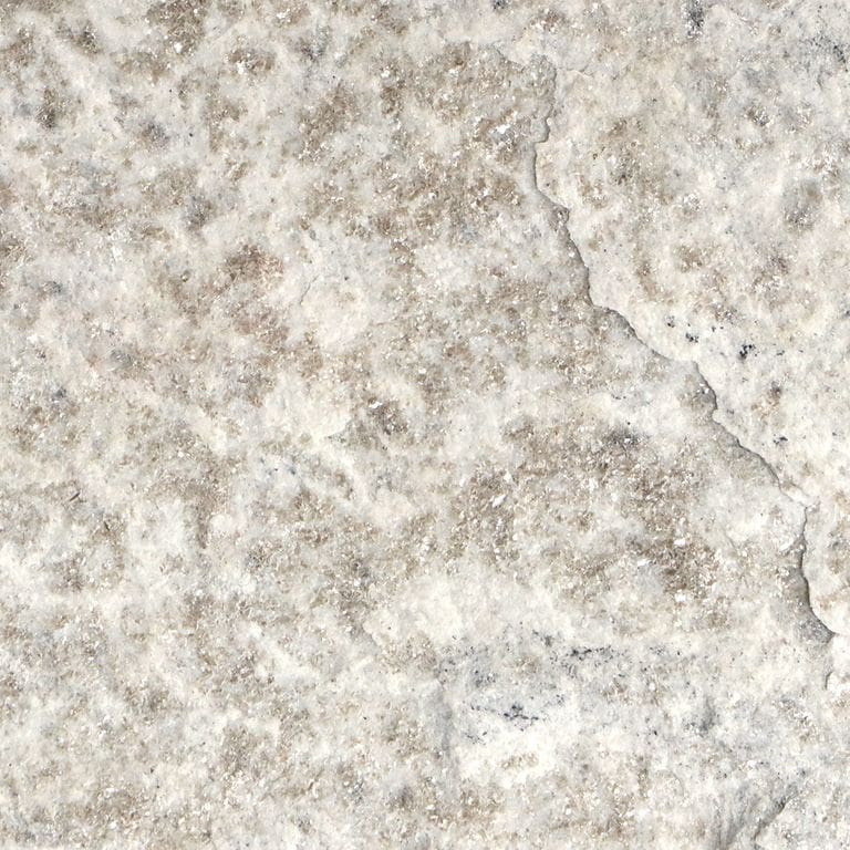 The surface finish shown is split-face. Dominant colors shown are beige, gray, white and cream. The color mix creates a cool feeling. Random, speckled, coarse speckled and blotched color patterns.