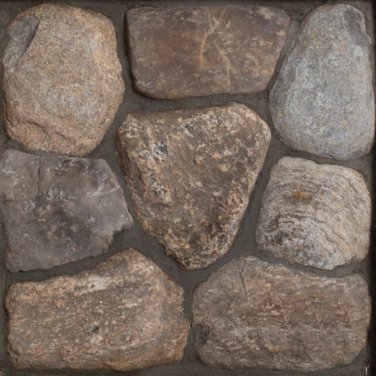 Close-up image for Old New England Rounds. The dominant color shown is brown; with green, gray, orange/rust, purple, tan and cream secondaries. Exhibits "movement" and the color mix creates a warm feeling. Random color pattern.