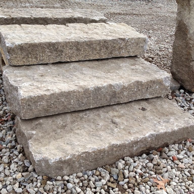 Application image for Deer Isle Granite. The image shows this material being used in a monolithic steps application. The surface finish shown is . Dominant colors shown are gray and pink. Regular color pattern.