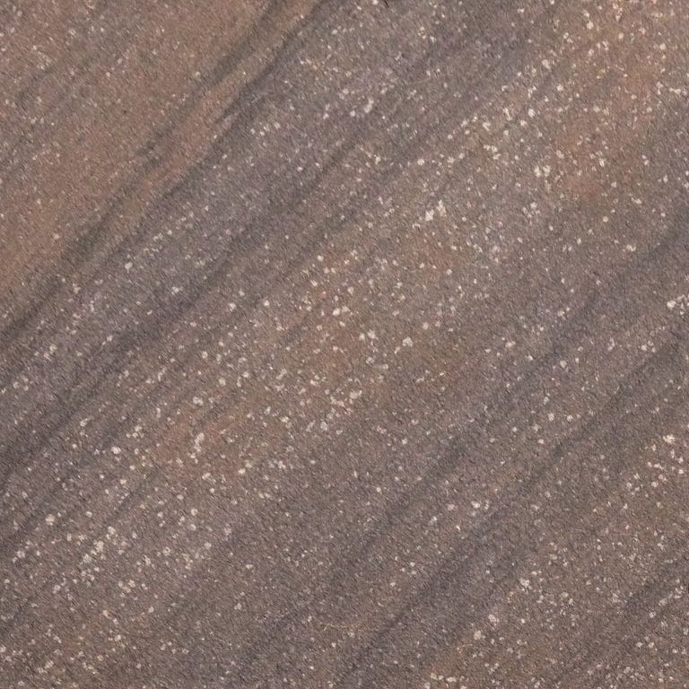 Best close-up image for Sandstone - Brown Wave. The surface finish shown is sand blasted. Dominant colors shown are brown and purple; with gray and tan secondaries. Exhibits "movement" and the color mix creates a warm feeling. Linear, streaked and speckled color patterns.