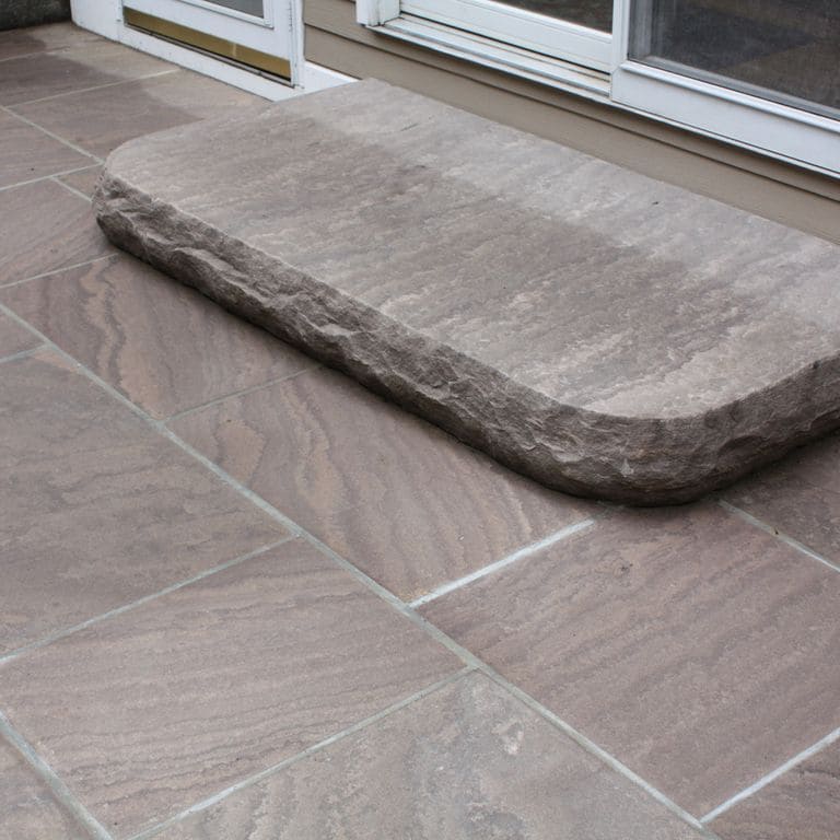 The image shows this material being used for patio pavers and monolithic steps.
