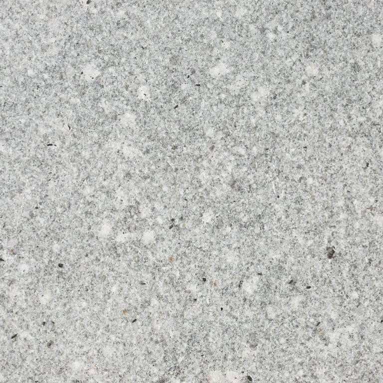 Feature image for Fancy Blue Granite. Dominant colors shown are gray and white; with beige, pink and cream secondaries. The color mix creates a cool feeling. Speckled, fine speckled and blotched color patterns.