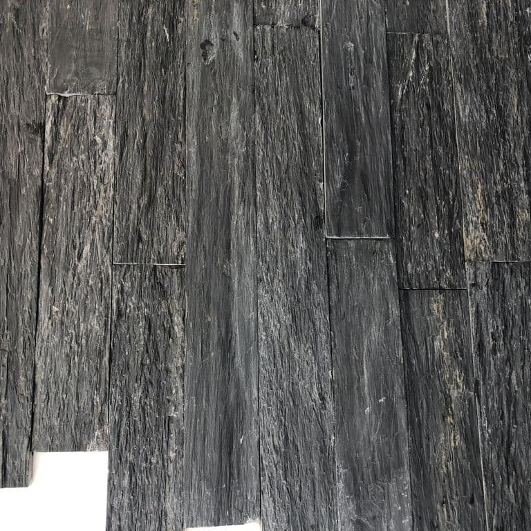 Color/Finish variation image for Black Schist. The surface finish shown is natural cleft. Dominant colors shown are black and gray; with a purple secondary. The color mix creates a cool feeling. Linear and blotched color patterns.