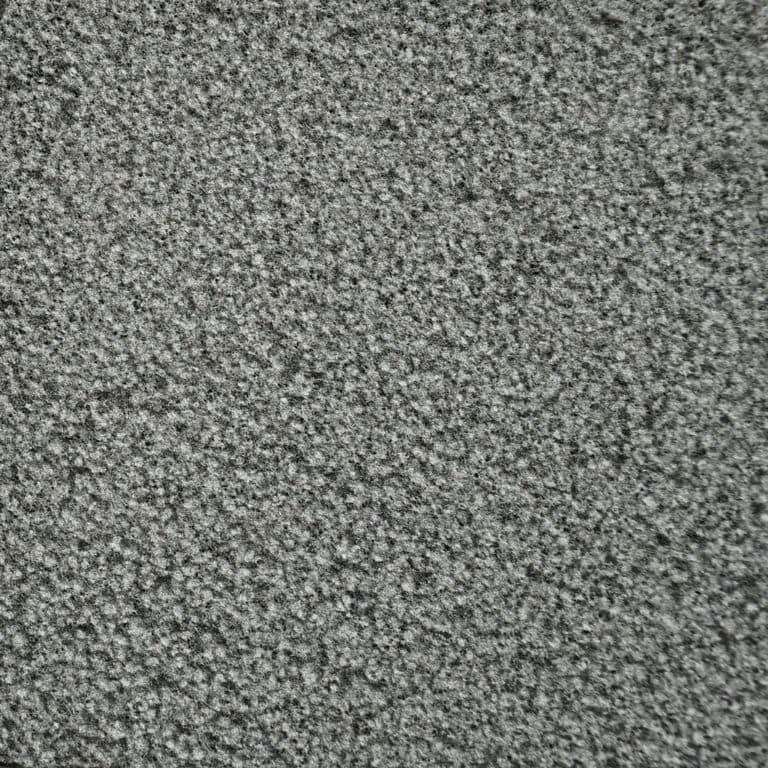 Color/Finish variation image for Ankar Gray Basalt. The surface finish shown is bush hammered. The dominant color shown is gray; with black, brown and green secondaries. The color mix creates a cool feeling. Speckled and coarse speckled color patterns.