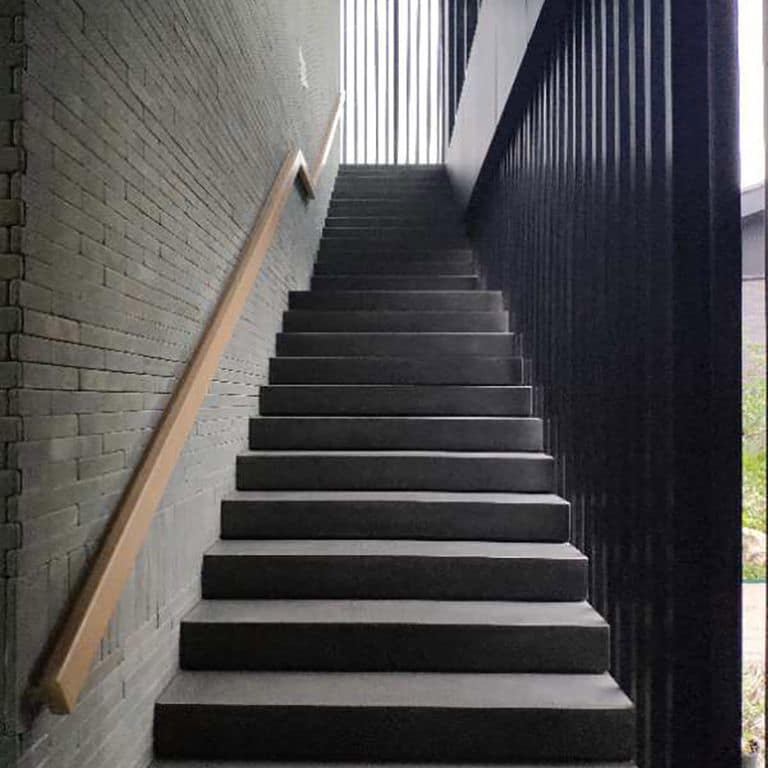 Application image for Ankar Gray Basalt with a honed surface finish. The image shows this material being used in a monolithic steps application. This is a building and landscape stone for indoor and outdoor commercial and residential applications. Suitable for general use, freeze-thaw conditions, low heat absorption surfaces, high traffic areas, low slipperiness surfaces and high heel compatibilty situations. Relatively higher in price.