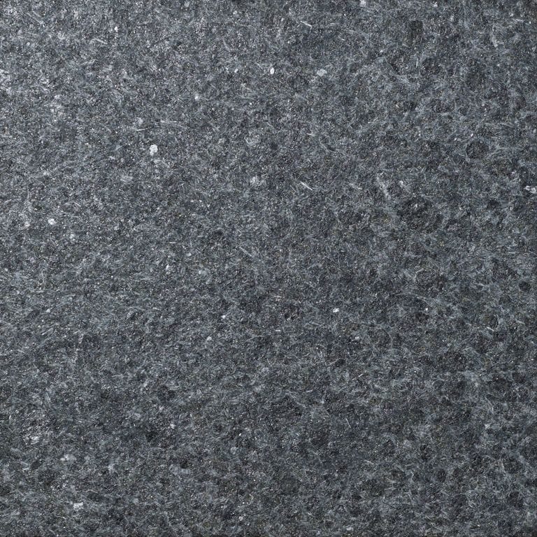 Color/Finish variation image for Granite - Zen Black. The surface finish shown is flamed. Dominant colors shown are black and gray. The color mix creates a cool feeling.