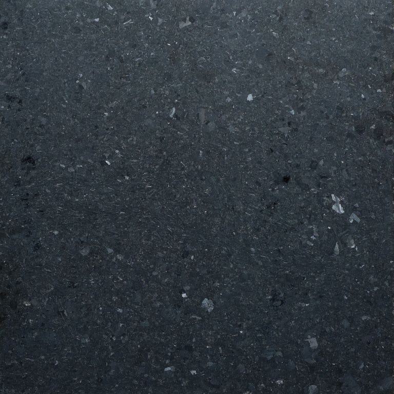 Color/Finish variation image for Zen Black Granite. The surface finish shown is honed. The dominant color shown is black. The color mix creates a cool feeling.