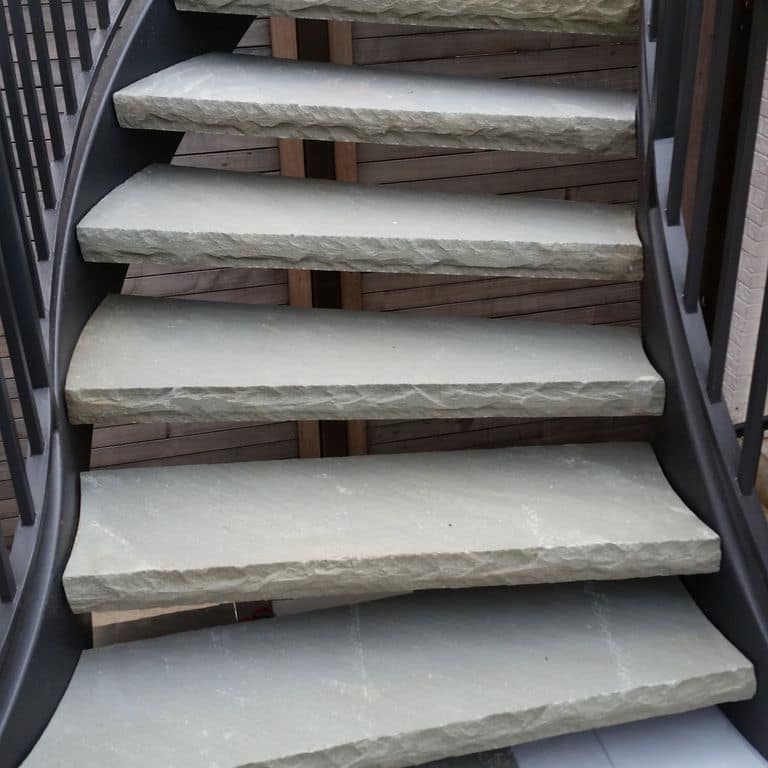 Application image for Bluestone Natural Cleft - Blue/Gray. The image shows this material being used in a treads application. This is a building and landscape stone for indoor and outdoor commercial and residential applications. Suitable for general use, freeze-thaw conditions, low slipperiness surfaces and high heel compatibilty situations. Low to moderate on the price spectrum.