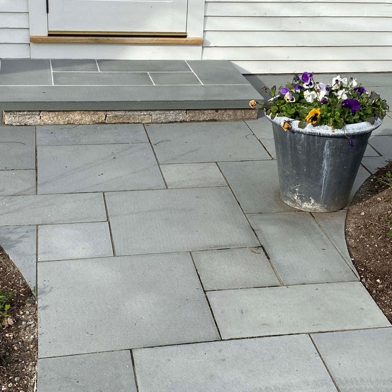Application image for Bluestone - Blue/Gray - Flamed Finish. The image shows this material being used in a path pavers application.