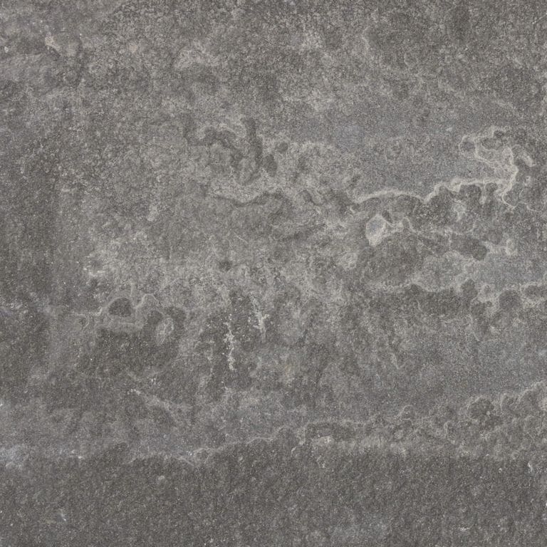 Best close-up image for Bluestone - Lilac - Natural Cleft. The surface finish shown is . The dominant color shown is gray; with brown and purple secondaries. Exhibits "movement" and the color mix creates a cool feeling. Random color pattern. Contains mineral inclusions.