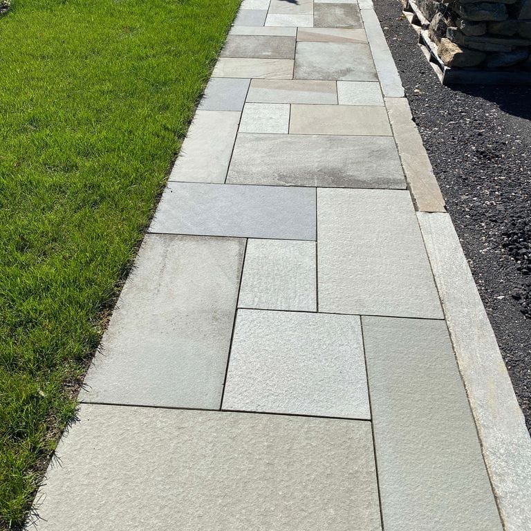 Application image for Bluestone - Full Color Mix. The image shows this material being used in a path pavers application.
