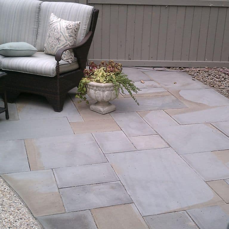 Application image for Bluestone - Full Color Mix. The image shows this material being used in a patio pavers application.