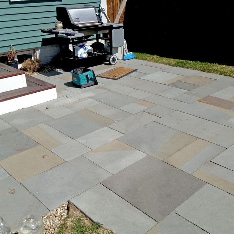 Application image for Bluestone - Full Color Mix. The image shows this material being used in a patio pavers application.