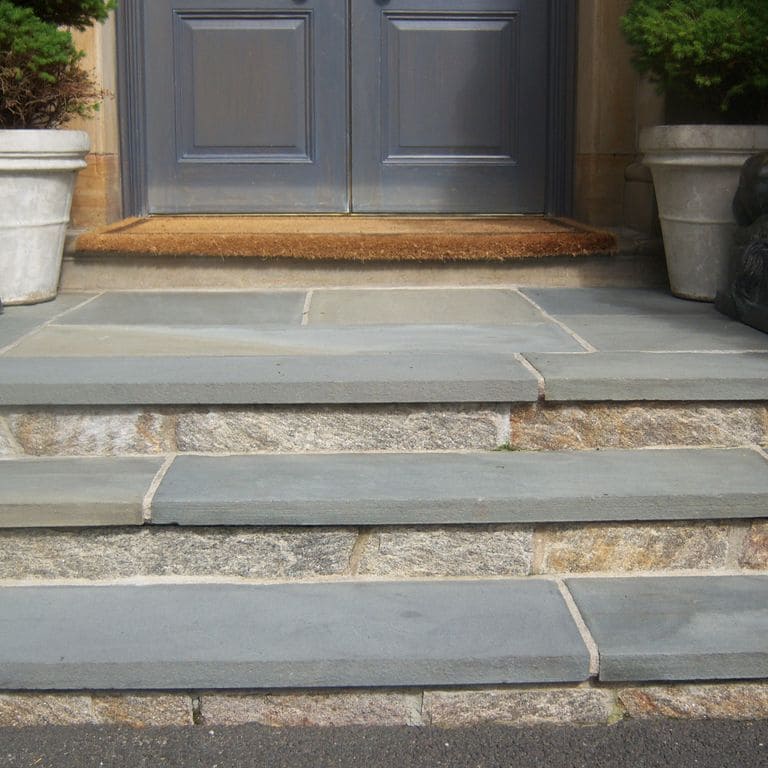 Application image for Bluestone - Full Color Mix. The image shows this material being used for patio pavers and treads.