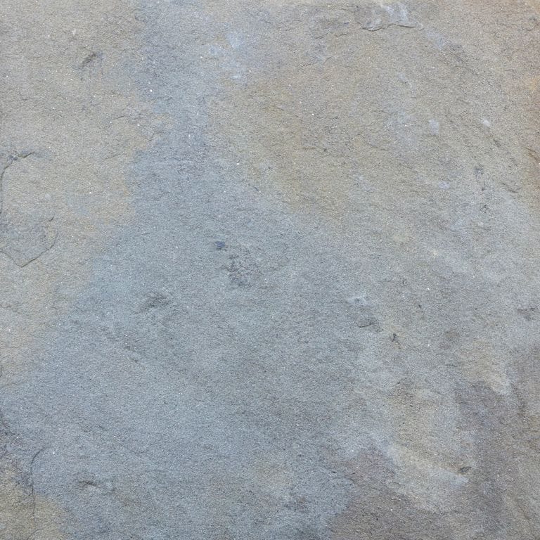 Color/Finish variation image for Bluestone Natural Cleft - Gunmetal. Dominant colors shown are beige, blue and gray; with purple, white and cream secondaries. Exhibits "movement" and the color mix creates a cool feeling. Random color pattern.