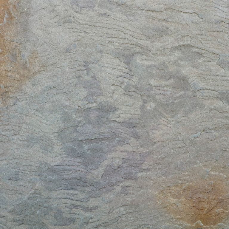 Color/Finish variation image for Bluestone Natural Cleft - Gunmetal. The dominant color shown is gray; with brown, green, orange/rust, purple and tan secondaries. Exhibits "movement" and the color mix creates a warm feeling. Random, blotched, linear and swirled color patterns.