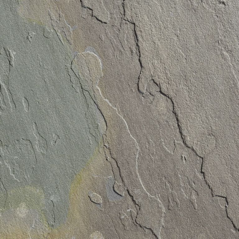 Feature image for Bluestone Natural Cleft - Gunmetal. The surface finish shown is natural cleft. Dominant colors shown are green and gray; with brown, orange/rust and purple secondaries. The color mix creates a warm feeling. Blotched color pattern.