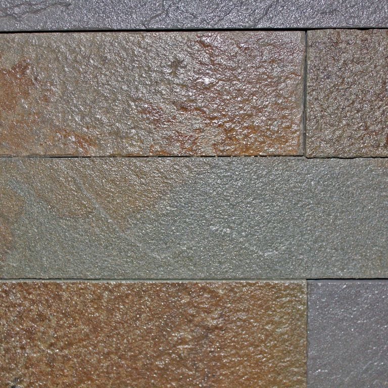 Close-up image for Bluestone Natural Cleft - Burgundy/Brown Mix. The surface finish shown is natural cleft. Dominant colors shown are brown, green and gray; with orange/rust, purple and tan secondaries. Exhibits "movement" and the color mix creates a warm feeling. Speckled and blotched color patterns.