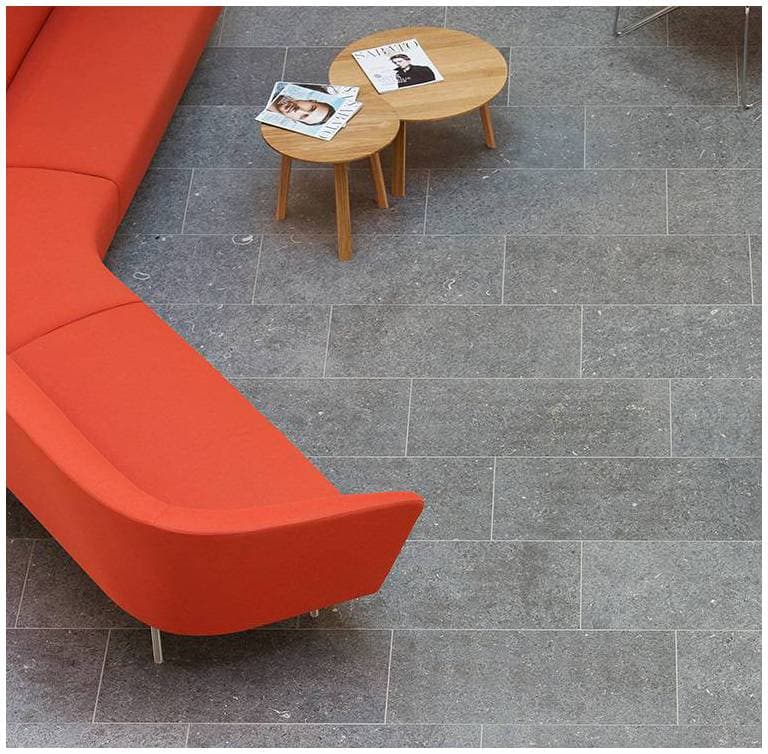 The image shows this material being used in an interior floor application. Regular, speckled, fine speckled and blotched color patterns.