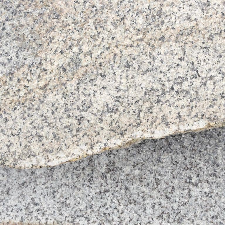 Color/Finish variation image for Granite - Reclaimed Rockport. The dominant color shown is gray; with beige, pink and cream secondaries. Exhibits "movement". Speckled, blotched and coarse speckled color patterns.