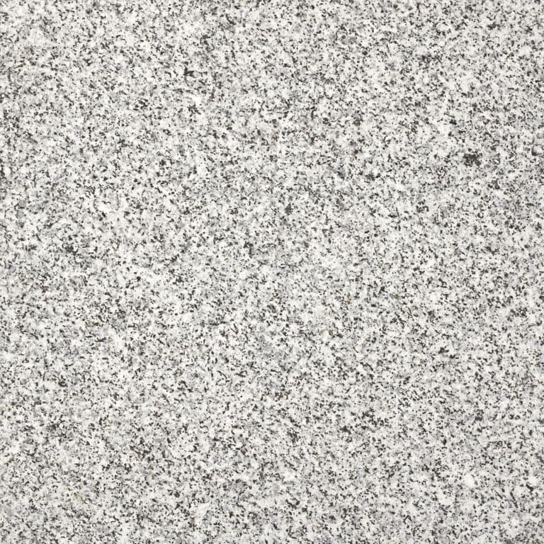 Color/Finish variation image for Dodlin Hill Granite. The surface finish shown is flamed. The dominant color shown is gray; with beige, white and cream secondaries. Speckled color pattern.