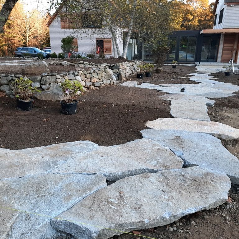 Application image for Granite - Dodlin Hill. The image shows this material being used in a path pavers application.