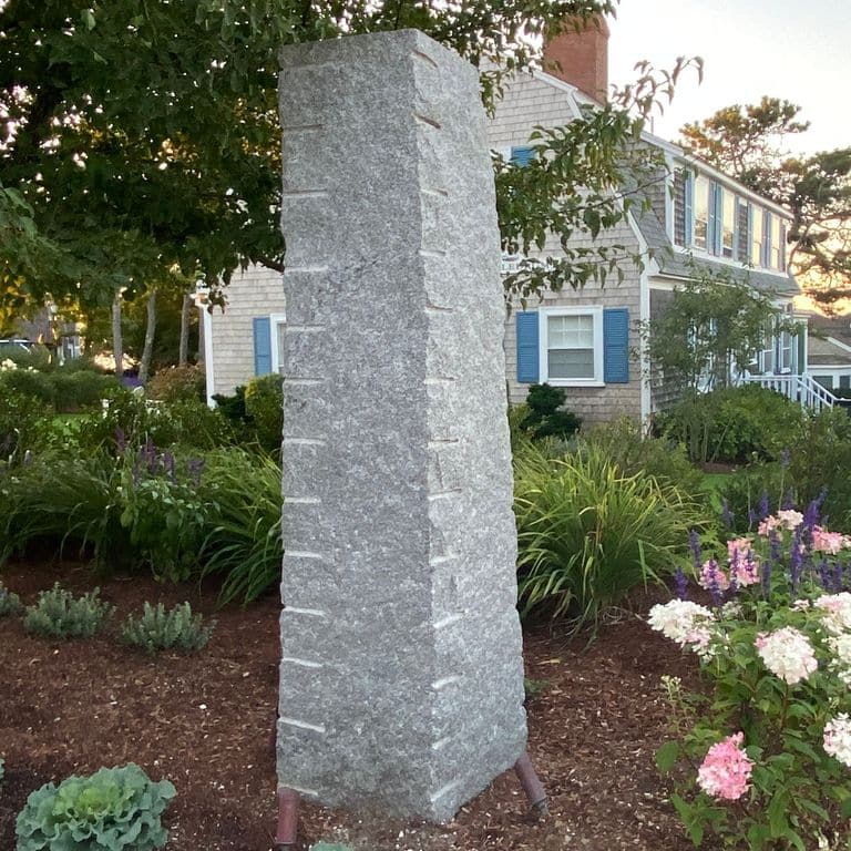 Application image for Dodlin Hill Granite. The image shows this material being used in a posts application. This is a building and landscape stone for indoor and outdoor commercial and residential applications. Suitable for general use, freeze-thaw conditions, low heat absorption surfaces, high traffic areas, low slipperiness surfaces and high heel compatibilty situations. Relatively moderate in price.