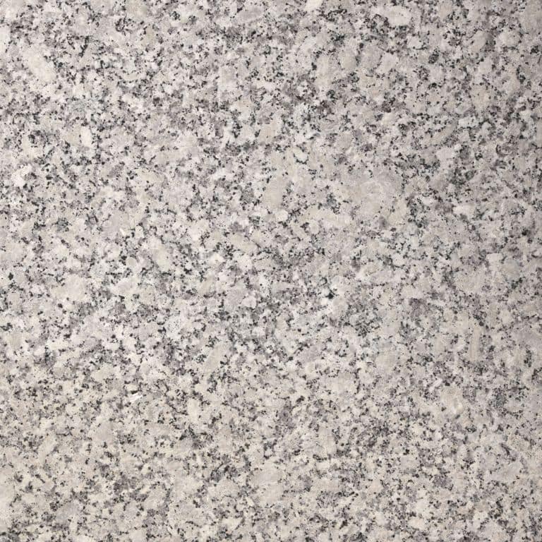 Feature image for Downeast Granite. Dominant colors shown are beige and gray; with pink, purple, white and cream secondaries. The color mix creates a warm feeling. Speckled, coarse speckled and blotched color patterns.