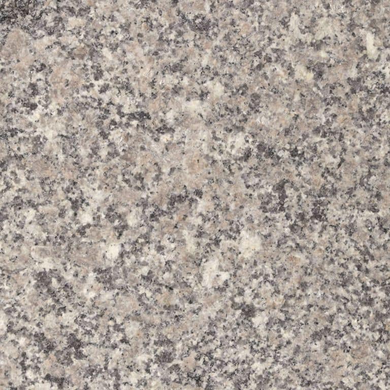 Feature image for Englishman's Bay Granite. The surface finish shown is sand blasted. Dominant colors shown are gray and pink; with beige, orange/rust, pink, purple, white, tan and cream secondaries. The color mix creates a warm feeling. Speckled and blotched color patterns.