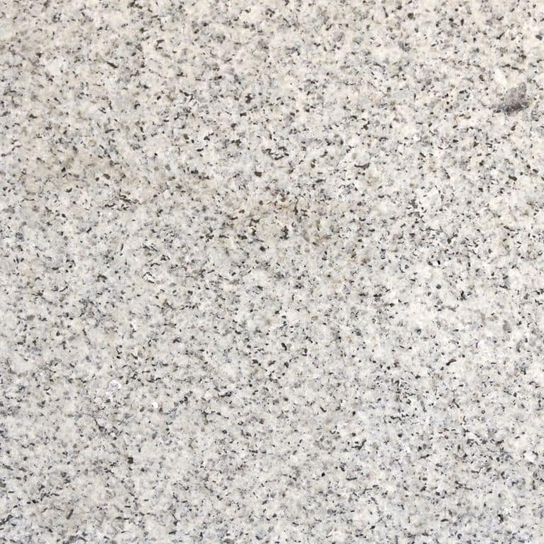 Color/Finish variation image for Kitledge Gray Granite. The surface finish shown is flamed. Dominant colors shown are beige, gray and white; with pink and cream secondaries. The color mix creates a cool feeling. Coarse speckled color pattern.