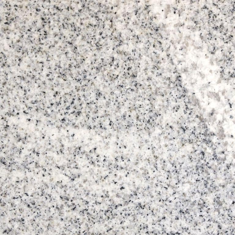 Color/Finish variation image for Kitledge Gray Granite. The surface finish shown is honed. The dominant color shown is gray; with beige, pink, white and cream secondaries. Exhibits "movement" and the color mix creates a cool feeling. Coarse speckled and veined color patterns.