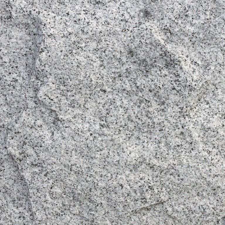 The surface finish shown is rockfaced. Dominant colors shown are gray and white. The color mix creates a cool feeling. Coarse speckled color pattern.