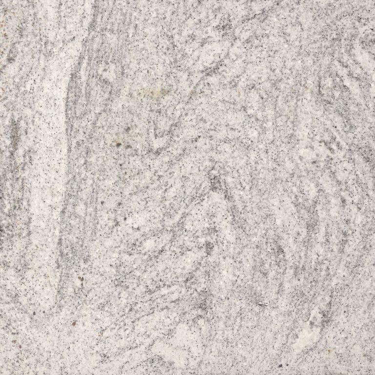 Feature image for Magog Mist Granite. Dominant colors shown are beige and gray; with pink, purple, white and cream secondaries. Exhibits "movement" and the color mix creates a warm feeling. Fine speckled and swirled color patterns.