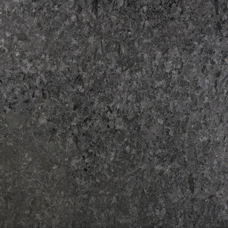 Color/Finish variation image for Granite - Mesabi Black. The surface finish shown is waterjet. The dominant color shown is black; with a green secondary. The color mix creates a cool feeling. Blotched and coarse speckled color patterns.
