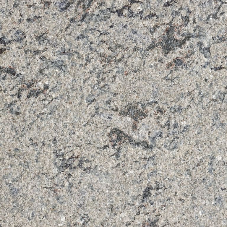 Best close-up image for Mountain Green® Granite. The surface finish shown is flamed. Dominant colors shown are brown, green and gray; with beige, black, blue, pink, purple, white, tan and cream secondaries. Blotched and coarse speckled color patterns. Contains some mica and mineral inclusions.