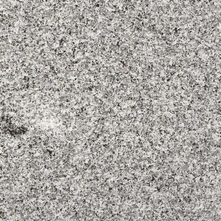 Feature image for Northern Gray Granite. The dominant color shown is gray; with beige and white secondaries. The color mix creates a cool feeling. Speckled and blotched color patterns. Contains some mica and mineral inclusions.