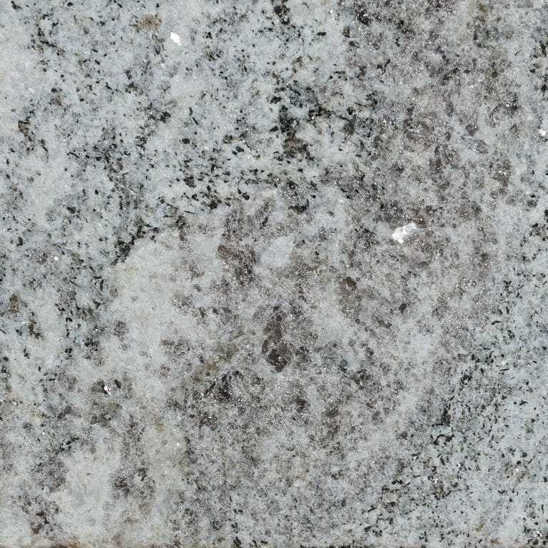 Color/Finish variation image for Silver Cloud Cross-Cut Granite. The surface finish shown is flamed. The dominant color shown is gray. The color mix creates a cool feeling.
