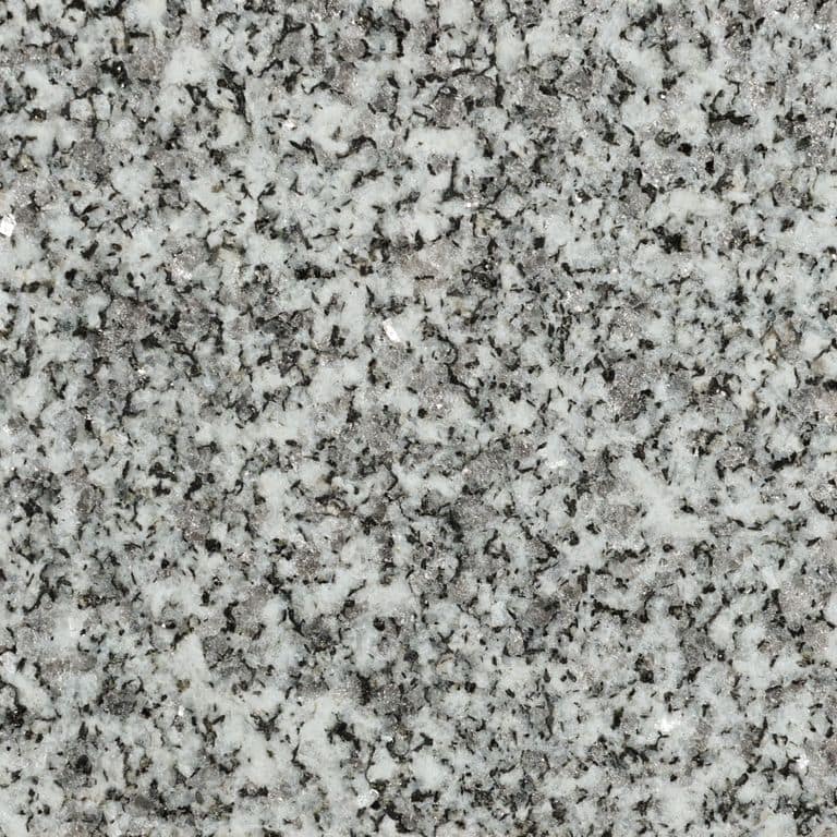 Feature image for Stanstead Granite. The surface finish shown is flamed. Dominant colors shown are gray and white; with beige, black and cream secondaries. The color mix creates a cool feeling. Speckled and coarse speckled color patterns. Contains some mica.
