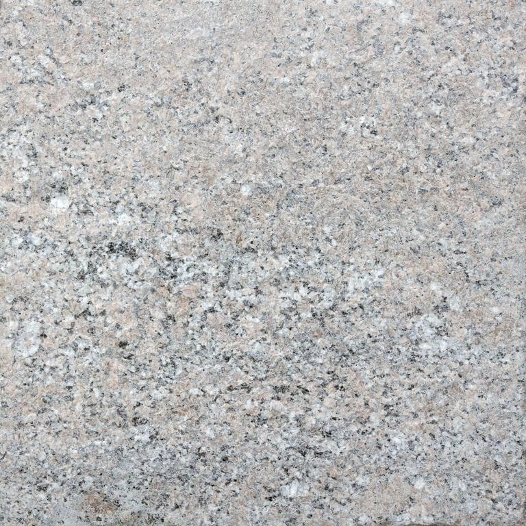 Color/Finish variation image for Stony Creek Granite. The surface finish shown is flamed. The dominant color shown is gray. The color mix creates a cool feeling. Speckled and random color patterns.