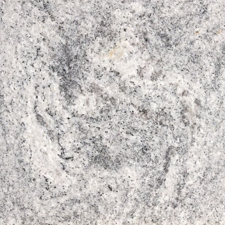 Color/Finish variation image for Tapestry Granite. The surface finish shown is flamed. The dominant color shown is gray; with beige, pink, white and cream secondaries. Exhibits "movement" and the color mix creates a cool feeling. Random and swirled color patterns.