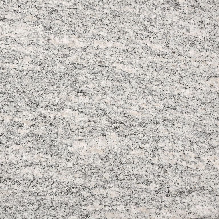 Feature image for Tapestry Granite. The surface finish shown is flamed. Dominant colors shown are beige and gray; with pink, purple, white, tan and cream secondaries. Exhibits "movement" and the color mix creates a warm feeling. Linear, fine speckled and cloudy color patterns. Contains some mica.