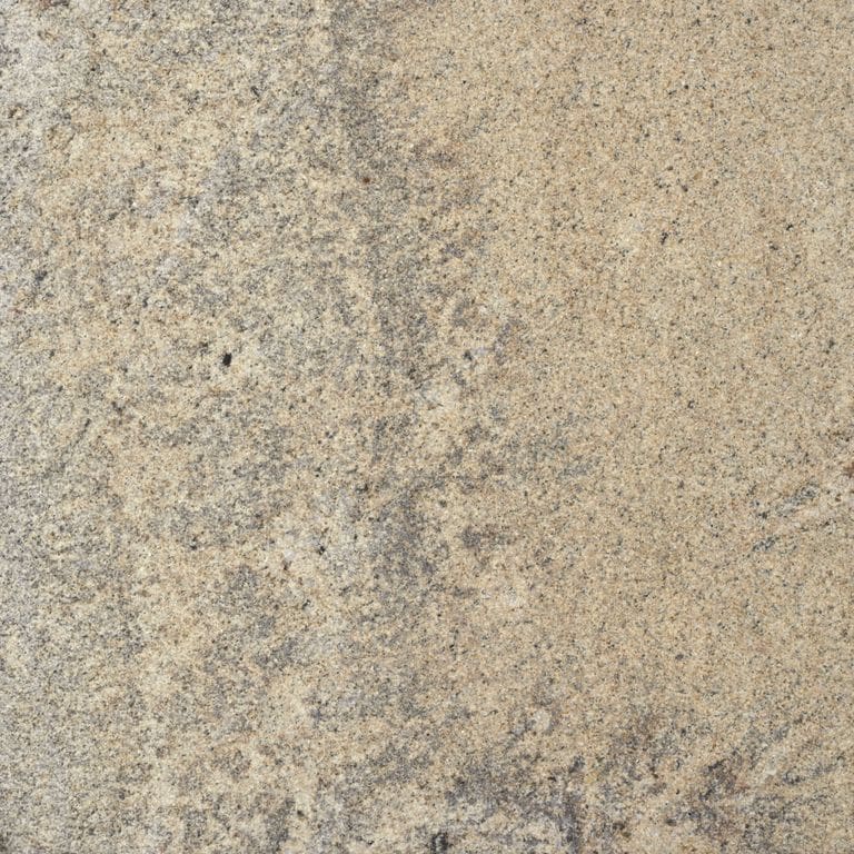 Feature image for Wheat Granite. Dominant colors shown are beige and tan; with brown, gray and orange/rust secondaries. Exhibits "movement" and the color mix creates a warm feeling. Random, fine speckled and swirled color patterns. Contains some mica and mineral inclusions.