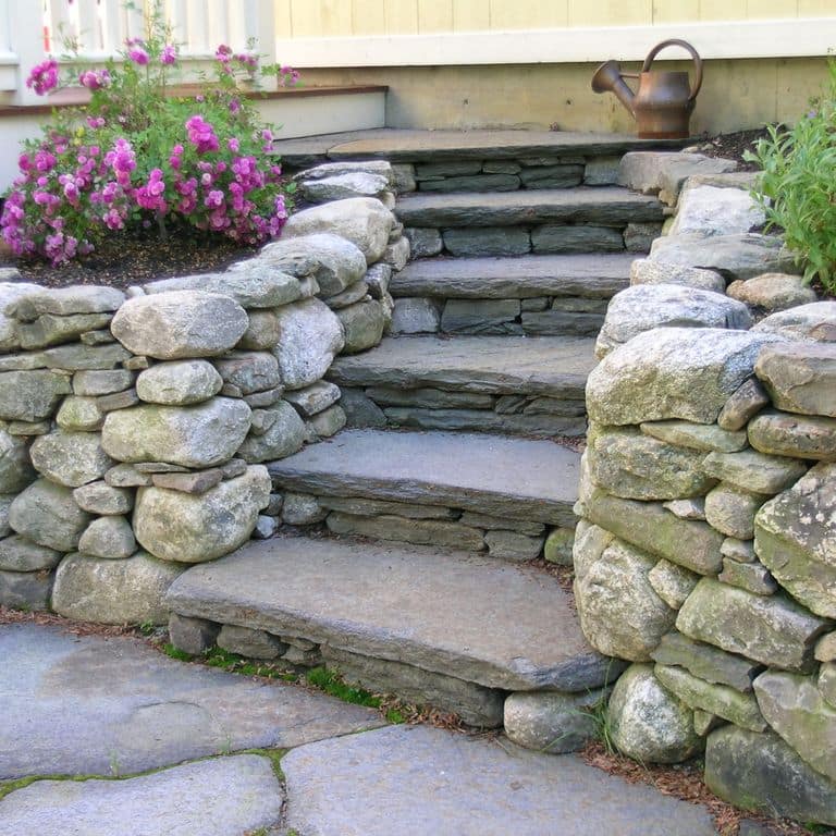 The image shows this material being used for patio pavers and treads. Speckled and blotched color patterns.