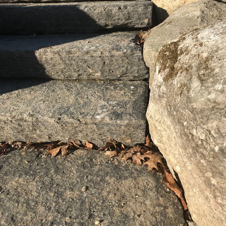 Application image for Goshen Stone. The image shows this material being used in a monolithic steps application. This is a building and landscape stone for indoor and outdoor commercial and residential applications. Suitable for general use, freeze-thaw conditions, high traffic areas and low slipperiness surfaces situations. Moderate to higher on the price spectrum.