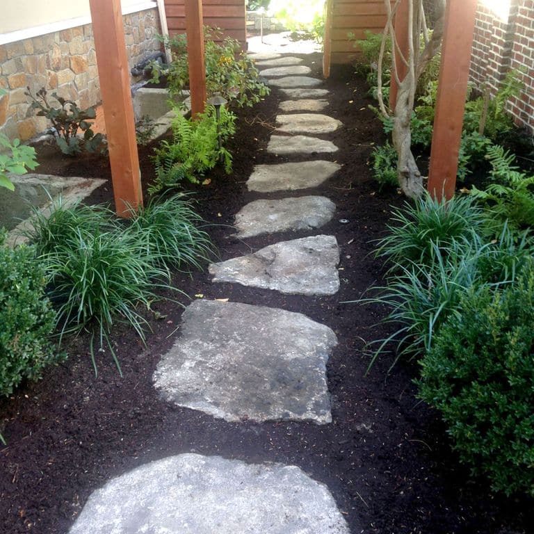 The image shows this material being used in a path pavers application. Blotched color pattern.