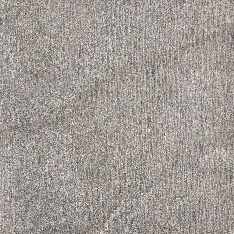 Color/Finish variation image for Jet Mist Granite. The surface finish shown is adze. The dominant color shown is gray; with beige, purple and white secondaries. Exhibits "movement" and the color mix creates a cool feeling. Linear, fine speckled, veined, random and cloudy color patterns.