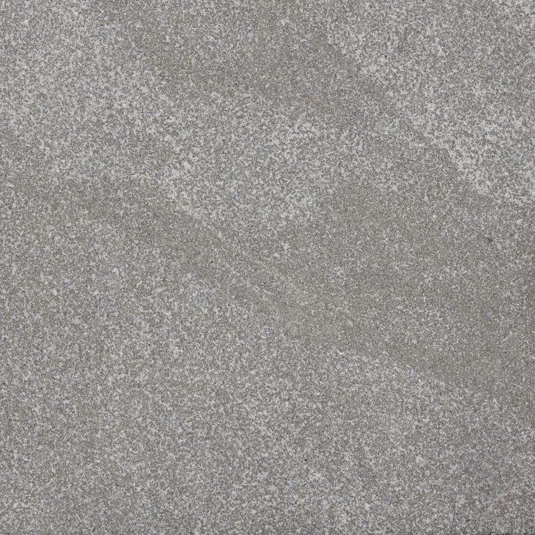 Color/Finish variation image for Jet Mist Granite. The surface finish shown is sand blasted. The dominant color shown is gray. Exhibits "movement" and the color mix creates a cool feeling. Fine speckled, streaked and cloudy color patterns.