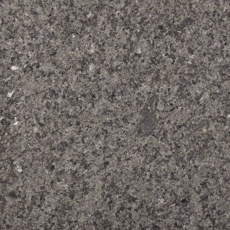 Color/Finish variation image for Granite - Prairie Green. The surface finish shown is flamed. Dominant colors shown are green and gray; with black, brown, green, purple and tan secondaries. Coarse speckled color pattern. Contains some mica and mineral inclusions.